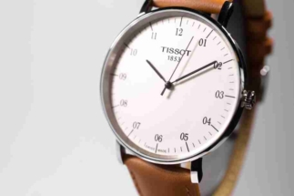 Le Locle, Switzerland 15.01.2020 - Tissot man watch stainless steel case, white clock face dial, leather strap, swiss quartz mechanical watch isolated, swiss made manufacture